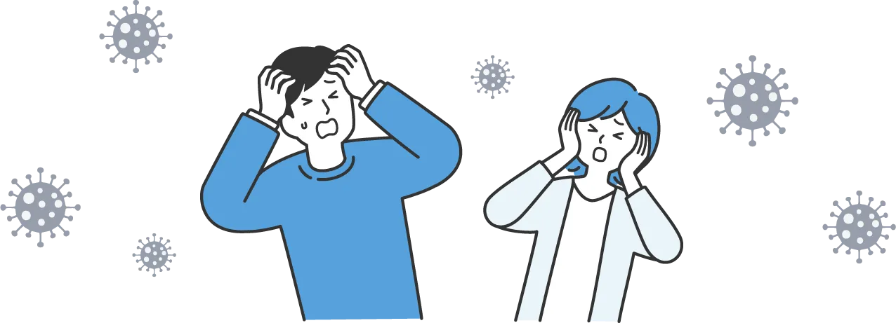 辛い表情をしながら頭を抱える男性と女性